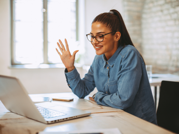 Happy woman have a video call using the laptop