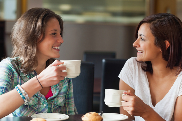 Two women talking while having coffee